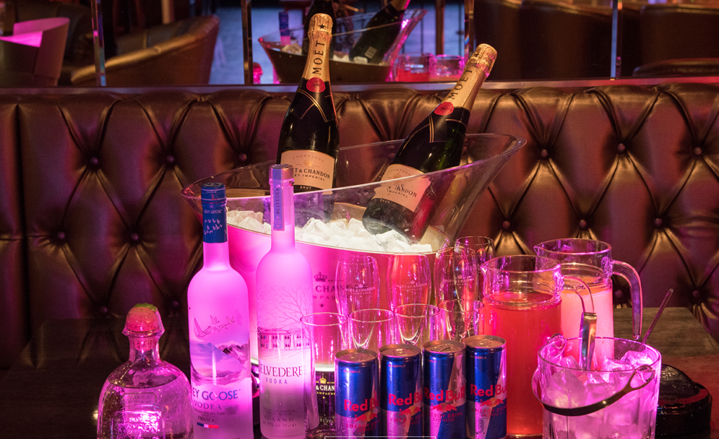 People drinking in VIP section